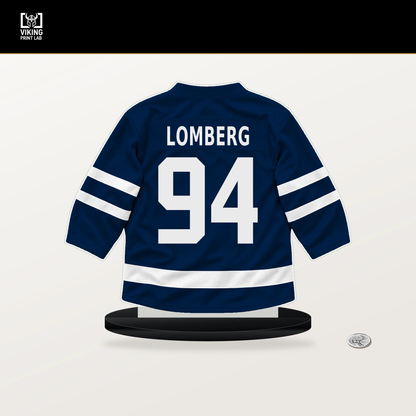 Ryan Lomberg number 94 Columbus Blue Jackets jersey stand with included black base.