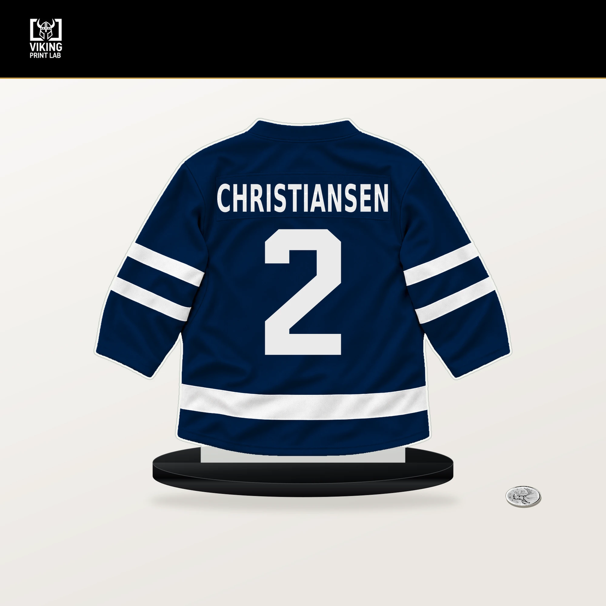 Jake Christiansen number 2 Columbus Blue Jackets jersey stand with included black base.