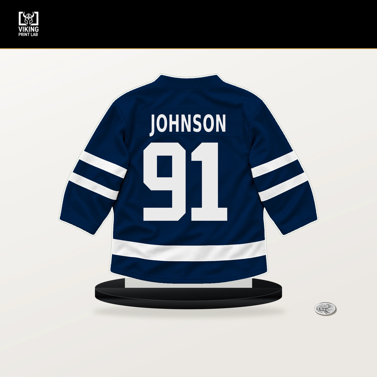 Kent Johnson number 91 Columbus Blue Jackets jersey stand with included black base.