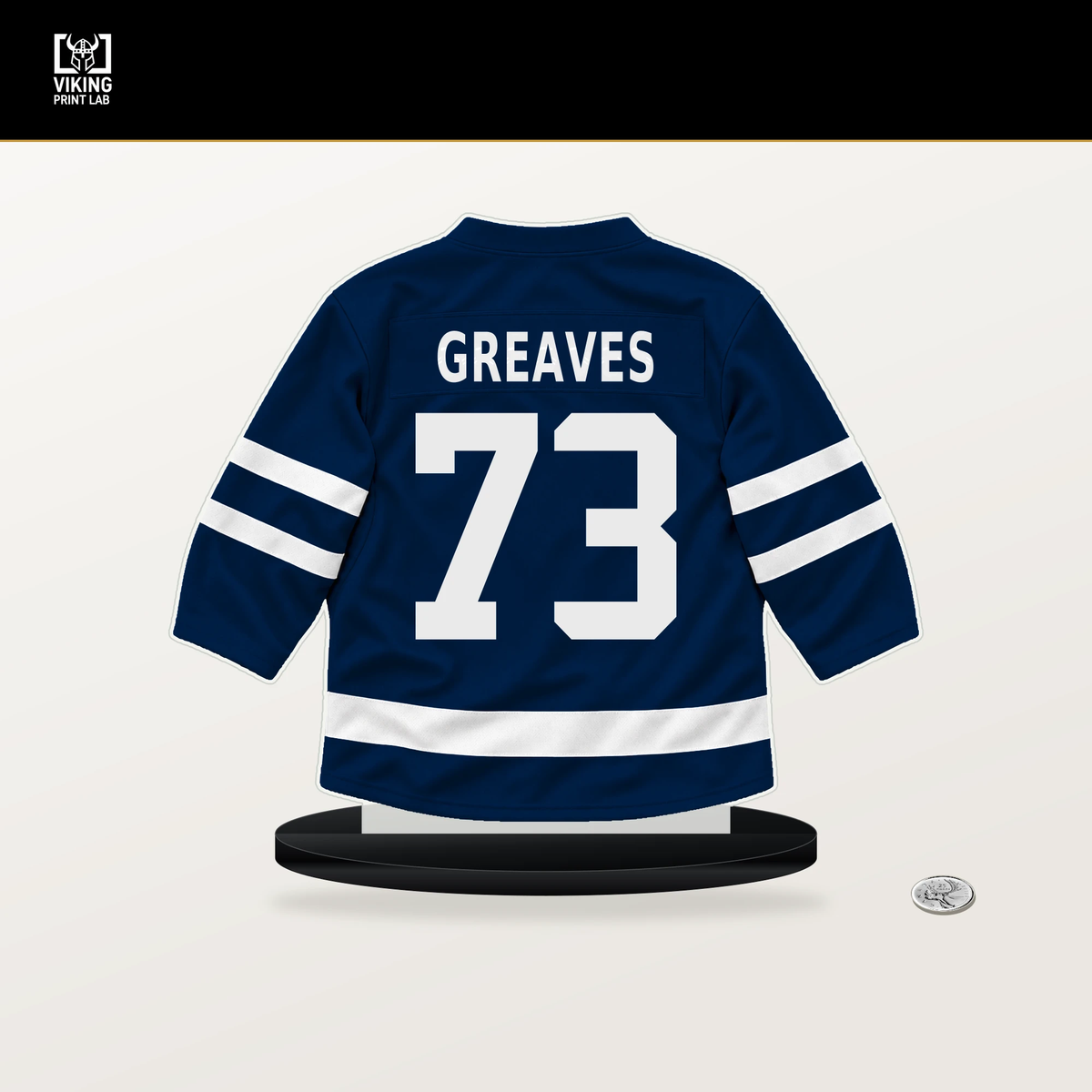 Jet Greaves number 73 Columbus Blue Jackets jersey stand with included black base.