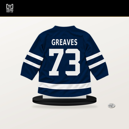 Jet Greaves number 73 Columbus Blue Jackets jersey stand with included black base.