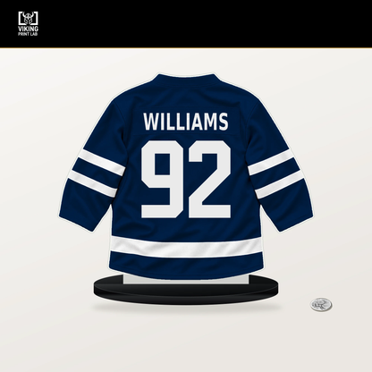 Jack Williams number 92 Columbus Blue Jackets jersey stand with included black base.