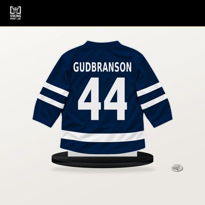 Erik Gudbranson number 44 Columbus Blue Jackets jersey stand with included black base.