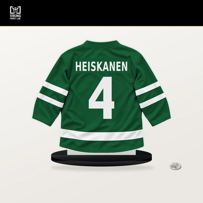 Miro Heiskanen number 4 Dallas Stars jersey stand with included black base.