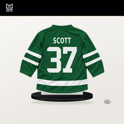 Harrison Scott number 37 Dallas Stars jersey stand with included black base.