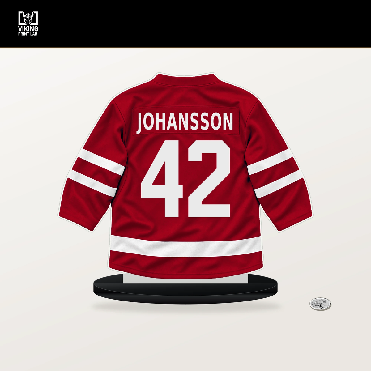 Anton Johansson number 42 Detroit Red Wings jersey stand with included black base.