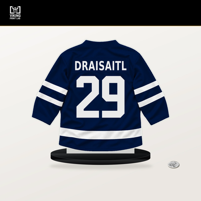 Leon Draisaitl number 29 Edmonton Oilers jersey stand with included black base.