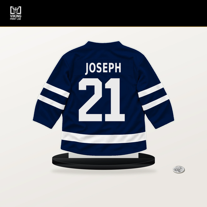 Mathieu Joseph number 21 Edmonton Oilers jersey stand with included black base.