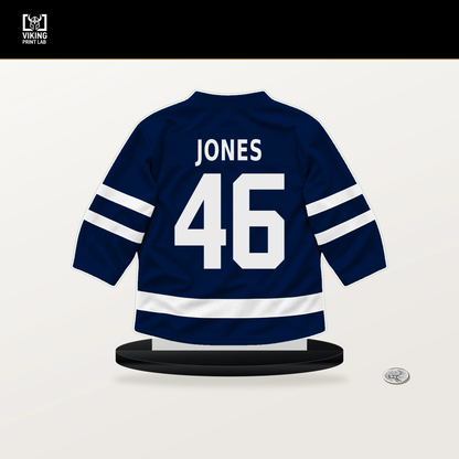 Max Jones number 46 Edmonton Oilers jersey stand with included black base.