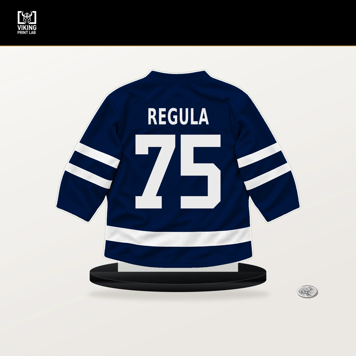 Alec Regula number 75 Edmonton Oilers jersey stand with included black base.