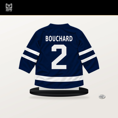Evan Bouchard number 2 Edmonton Oilers jersey stand with included black base.