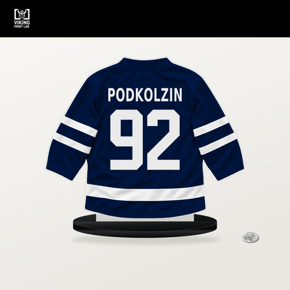 Vasily Podkolzin number 92 Edmonton Oilers jersey stand with included black base.