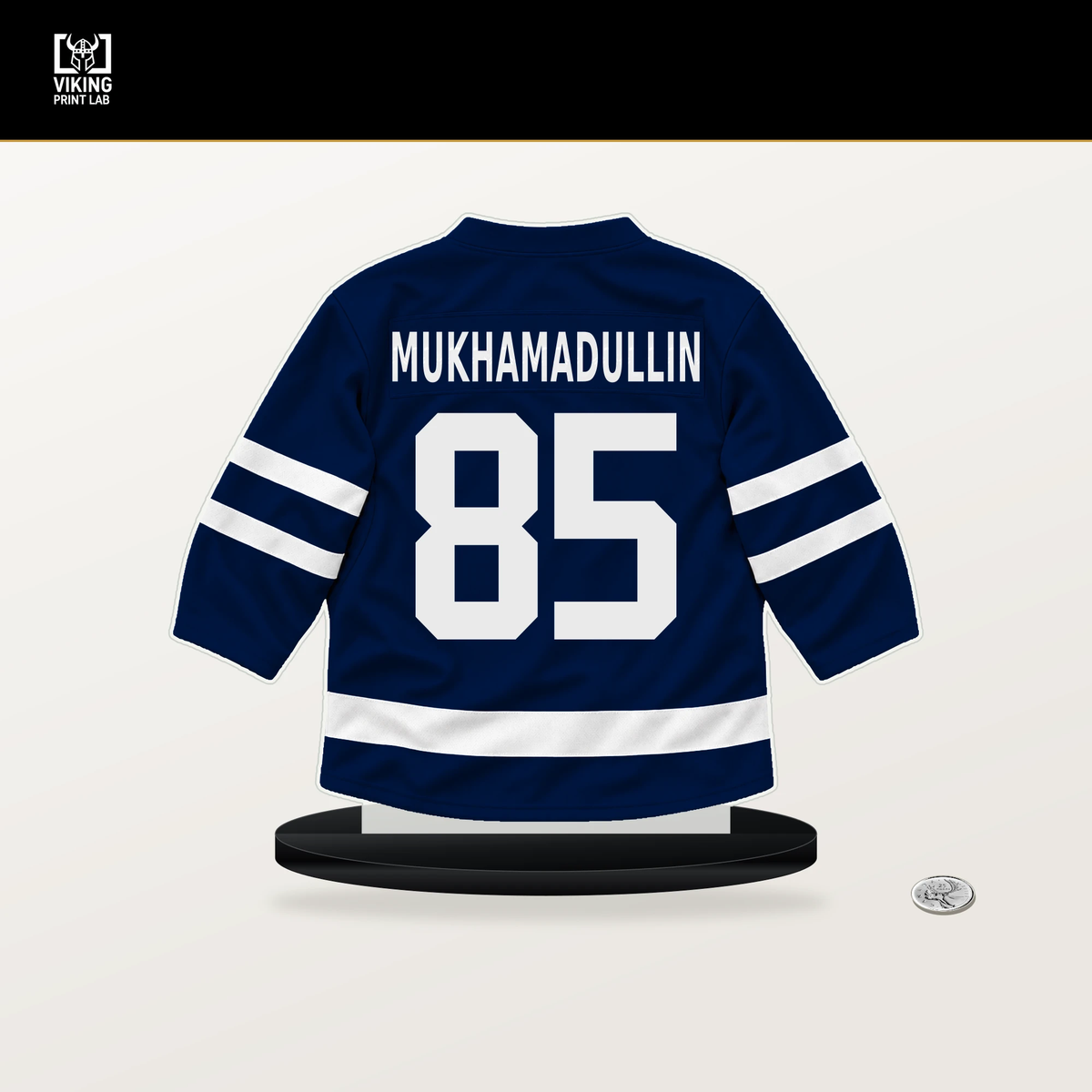 Shakir Mukhamadullin number 85 Edmonton Oilers jersey stand with included black base.