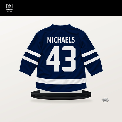Owen Michaels number 43 Edmonton Oilers jersey stand with included black base.