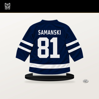 Josh Samanski number 81 Edmonton Oilers jersey stand with included black base.
