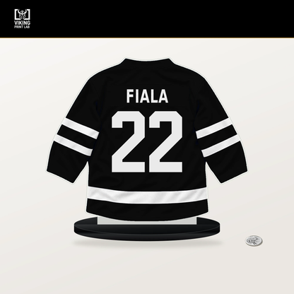 Kevin Fiala number 22 Los Angeles Kings jersey stand with included black base.
