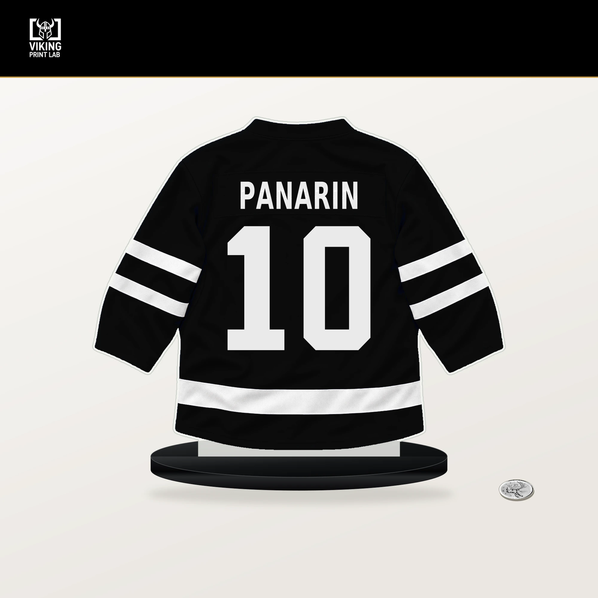 Artemi Panarin number 10 Los Angeles Kings jersey stand with included black base.