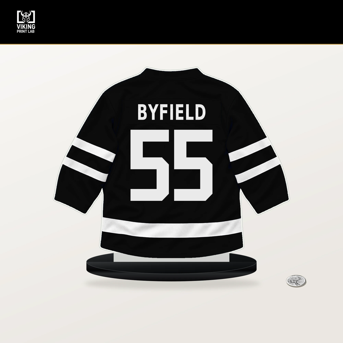 Quinton Byfield number 55 Los Angeles Kings jersey stand with included black base.