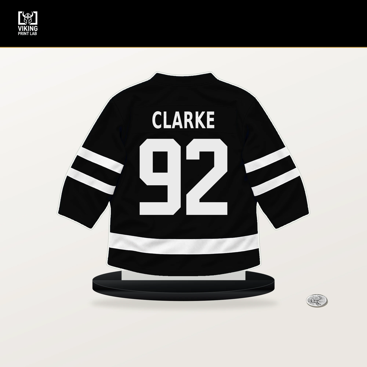 Brandt Clarke number 92 Los Angeles Kings jersey stand with included black base.