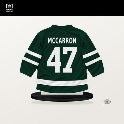 Michael McCarron number 47 Minnesota Wild jersey stand with included black base.
