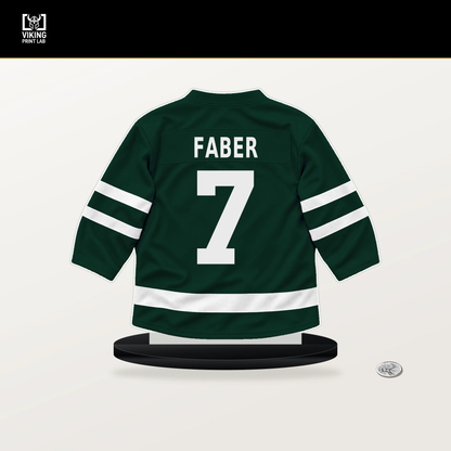 Brock Faber number 7 Minnesota Wild jersey stand with included black base.