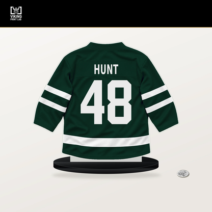 Daemon Hunt number 48 Minnesota Wild jersey stand with included black base.