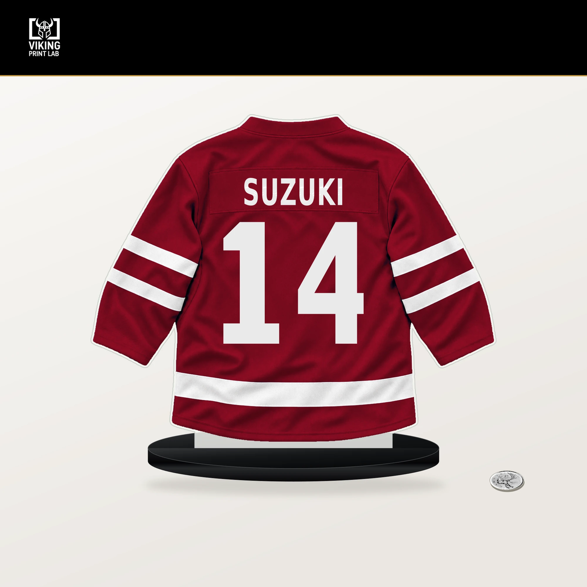 Nick Suzuki number 14 Montreal Canadiens jersey stand with included black base.
