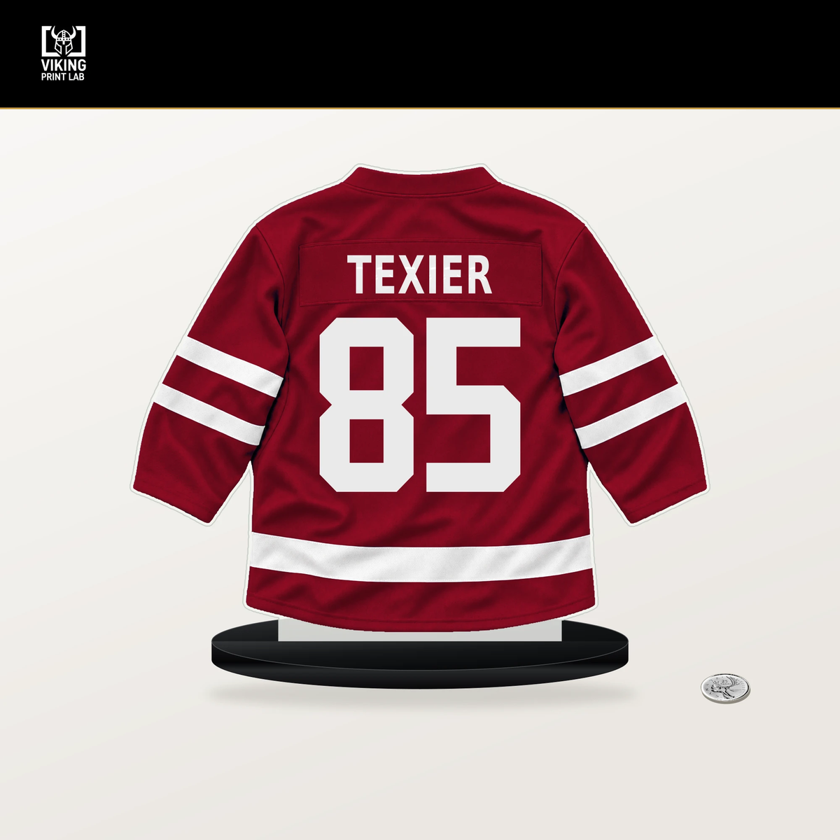 Alexandre Texier number 85 Montreal Canadiens jersey stand with included black base.