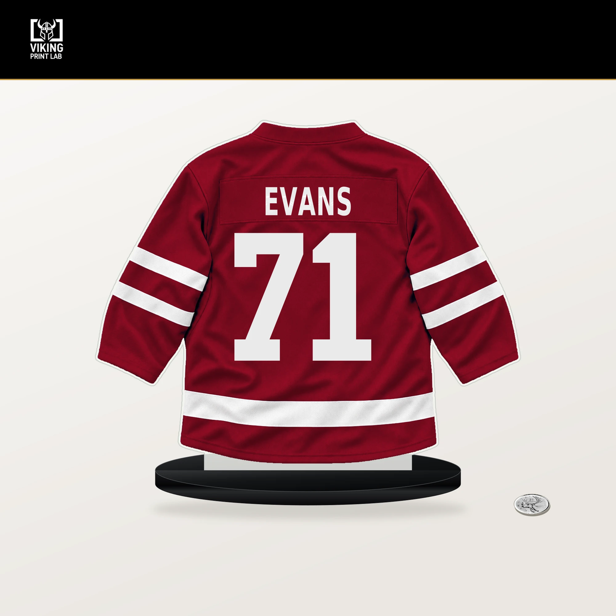 Jake Evans number 71 Montreal Canadiens jersey stand with included black base.