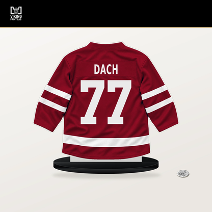 Kirby Dach number 77 Montreal Canadiens jersey stand with included black base.