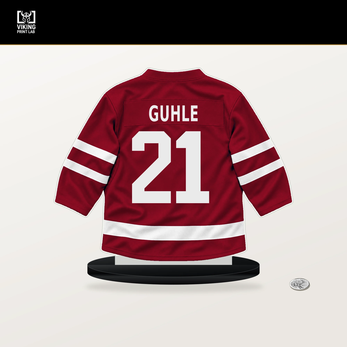 Kaiden Guhle number 21 Montreal Canadiens jersey stand with included black base.