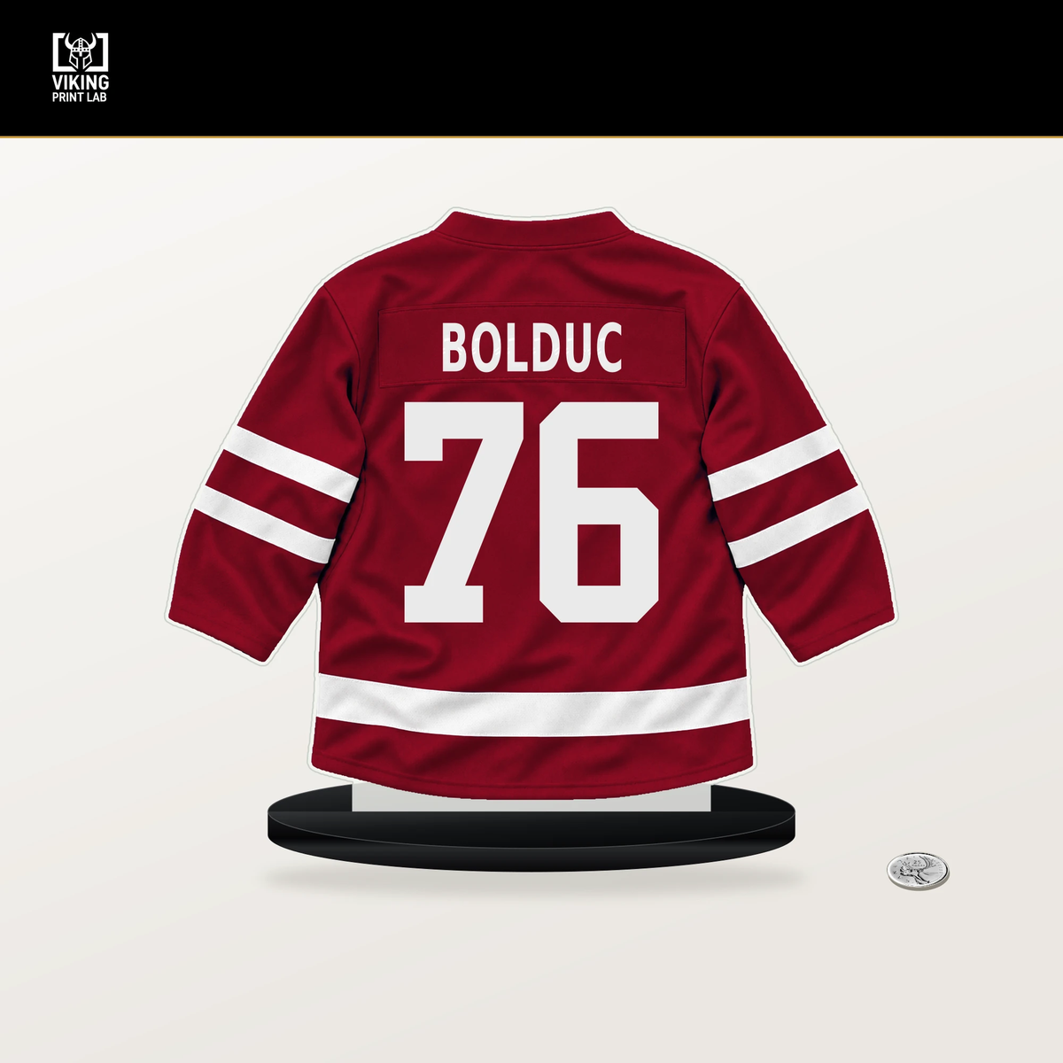 Zack Bolduc number 76 Montreal Canadiens jersey stand with included black base.