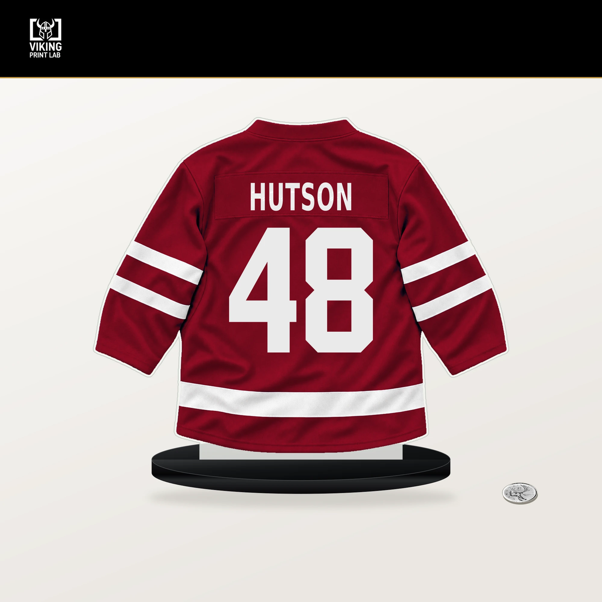 Lane Hutson number 48 Montreal Canadiens jersey stand with included black base.