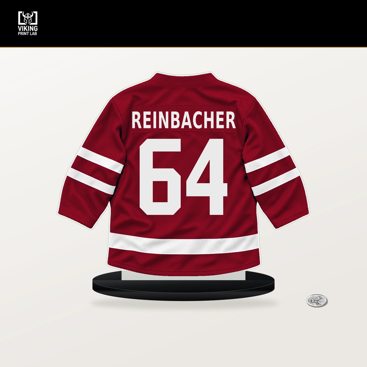 David Reinbacher number 64 Montreal Canadiens jersey stand with included black base.