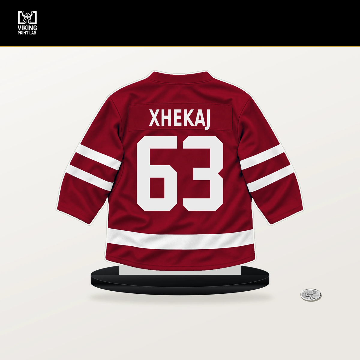 Florian Xhekaj number 63 Montreal Canadiens jersey stand with included black base.