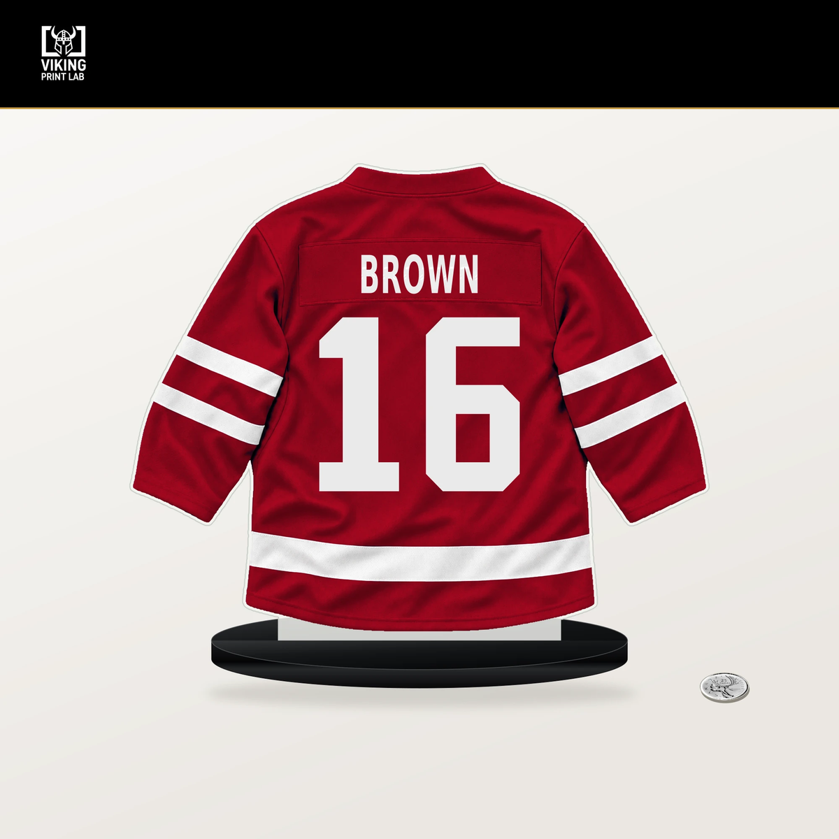 Connor Brown number 16 New Jersey Devils jersey stand with included black base.