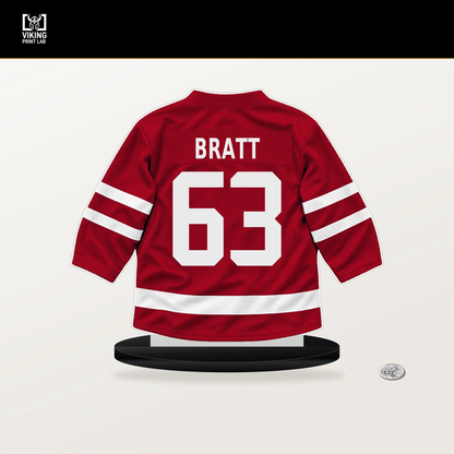Jesper Bratt number 63 New Jersey Devils jersey stand with included black base.