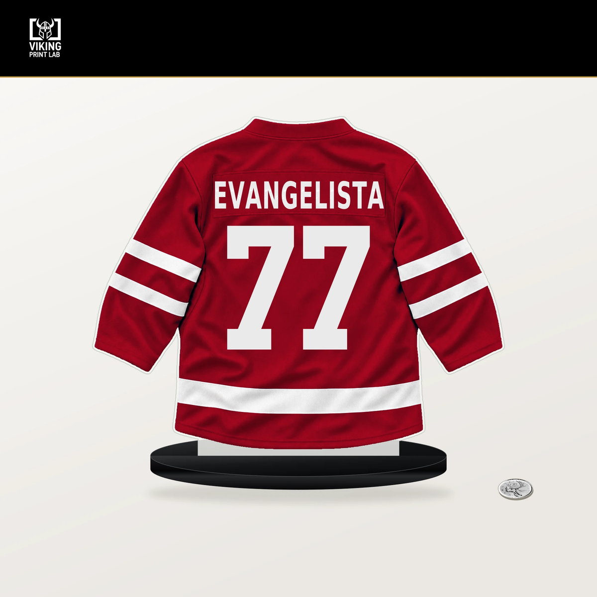 Luke Evangelista number 77 New Jersey Devils jersey stand with included black base.