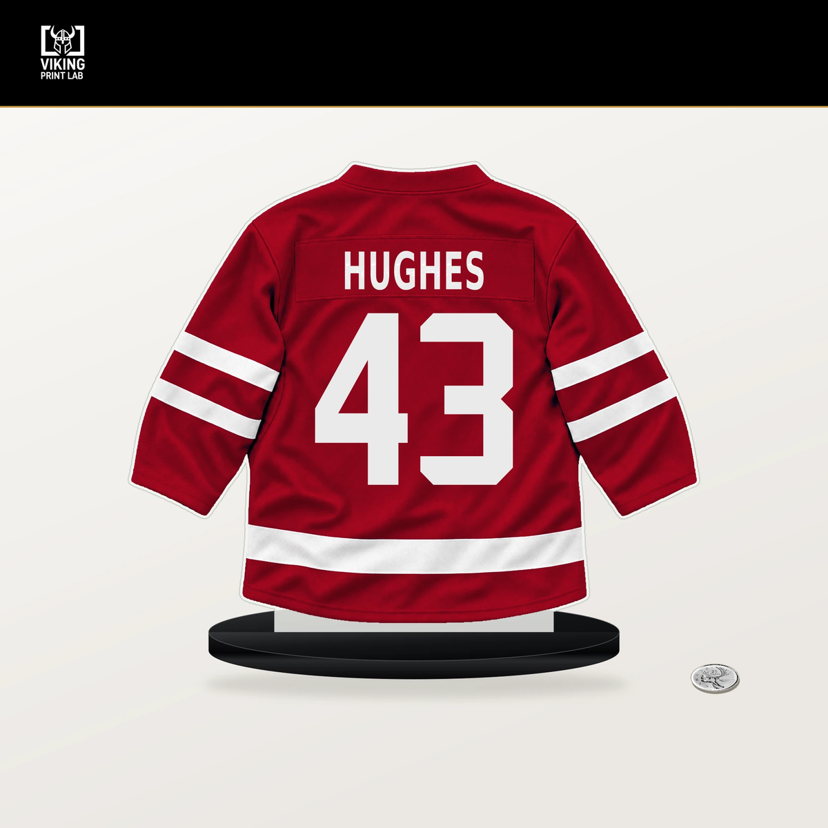 Luke Hughes number 43 New Jersey Devils jersey stand with included black base.