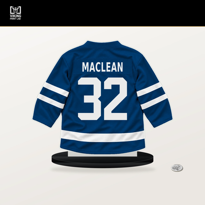 Kyle MacLean number 32 New York Islanders jersey stand with included black base.