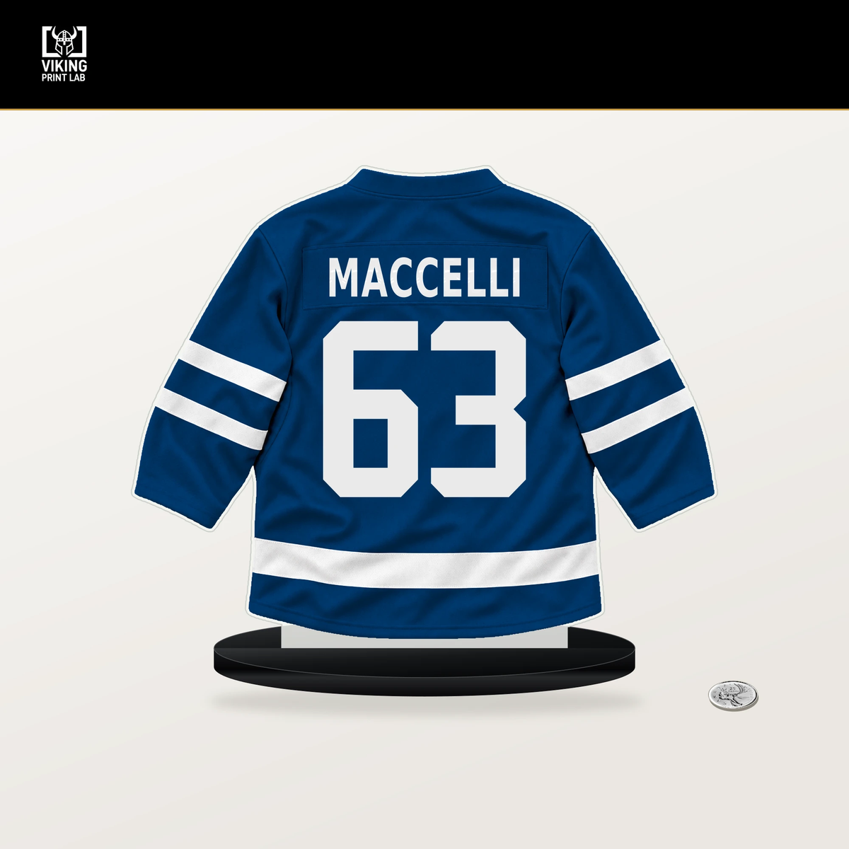 Matias Maccelli number 63 New York Islanders jersey stand with included black base.