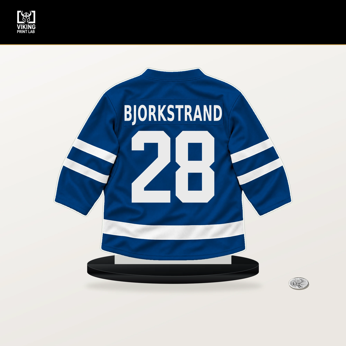 Oliver Bjorkstrand number 28 New York Rangers jersey stand with included black base.