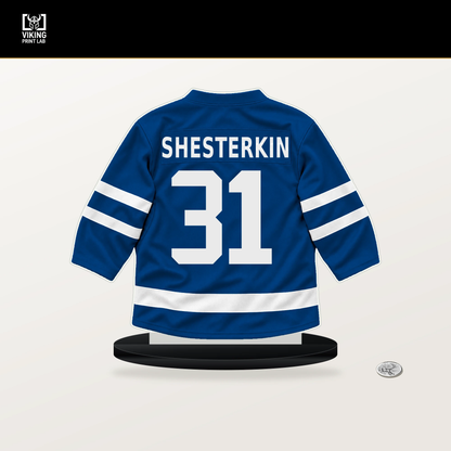 Igor Shesterkin number 31 New York Rangers jersey stand with included black base.