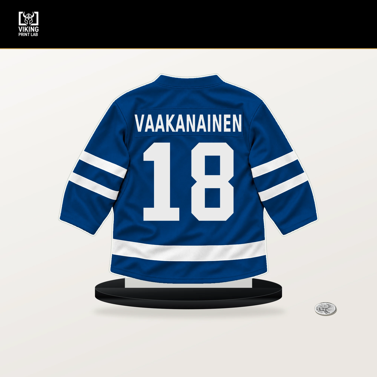 Urho Vaakanainen number 18 New York Rangers jersey stand with included black base.