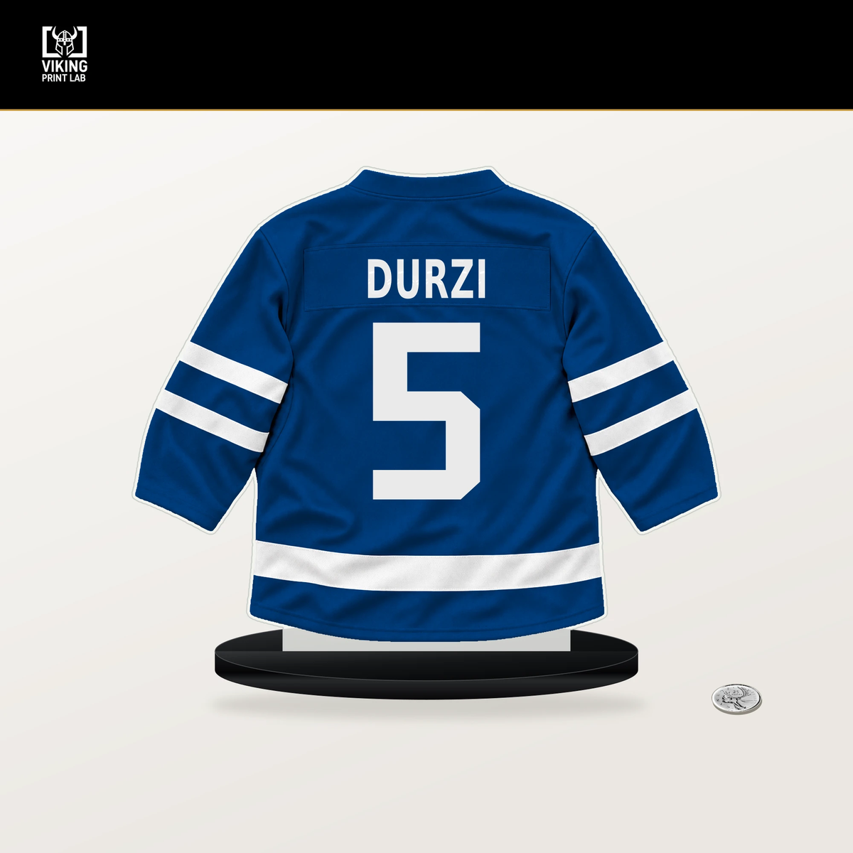 Sean Durzi number 5 New York Rangers jersey stand with included black base.