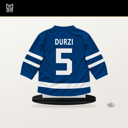 Sean Durzi number 5 New York Rangers jersey stand with included black base.