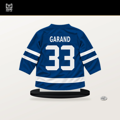 Dylan Garand number 33 New York Rangers jersey stand with included black base.