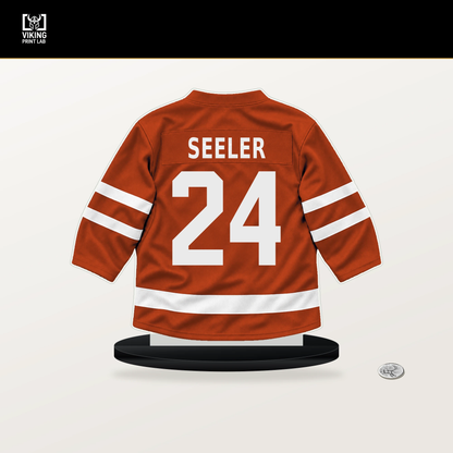Nick Seeler number 24 Philadelphia Flyers jersey stand with included black base.