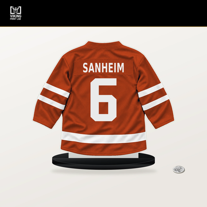 Travis Sanheim number 6 Philadelphia Flyers jersey stand with included black base.