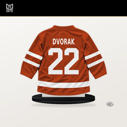 Christian Dvorak number 22 Philadelphia Flyers jersey stand with included black base.
